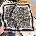 Detail showing paisley silk scarf with yellow accents on a white decorative background - Paisley Black (ZS-470-Black) / 53*53cm