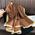 Women's silk-like long scarf with floral prints and gold edges draped on a brown background - Large / Coffee (F-378)