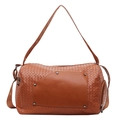 Brown woven travel bag with leather patch and silver rivets on a white background - Brown