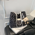 Quilted black tote bag with pink bow prints, white handles, and a cute plush bear charm - With Charm / Black