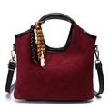 Quilted burgundy bucket bag with black leather trim and wooden bead charm detail - Burgundy (Suede-Look/No Charm)