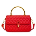 Fashionable red quilted handbag with gold bamboo handle and adjustable shoulder strap - Red