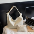 Creamy white oversized knotted tote bag with matching zippered pouch in soft faux leather - Off White