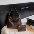 Brown leather tote bag with knotted handle and matching pouch for daily commute - Coffee