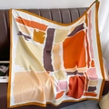 Detailed macro view of abstract silk square scarf with orange and brown geometric brushstrokes - Orange Abstract Color Block Style (XW-79)