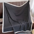 Black and white polka dot silk scarf with letter print draped on a leather sofa - 90*90cm / Black