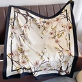 Elegant satin square scarf with magnolia flower print and black contrast borders on sofa - 90*90cm / Beige