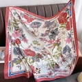 Close-up of tropical floral and zebra print satin scarf draped on a leather couch - 90*90cm / Pink