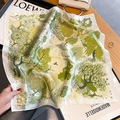 Silk square scarf with green forest deer print on an elegant wooden tabletop setting - Forest Green (ZS-469) / 53*53cm