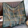 Detail of green and white plaid scarf with orange Fashion Modern text on leather sofa - Green & White Houndstooth (XW-15-Green)