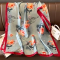Detailed texture of a silk scarf with lotus patterns and red borders on a leather sofa - Grey Blue Red Border / 80x180cm