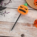 Halloween cartoon pumpkin plush ball pen with black ink on a decorative wooden background - Black Barrel Angry Pumpkin
