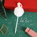 Cute Christmas Santa Claus ballpoint pen with white pom pom on a festive red gift background - Santa Claus / White
