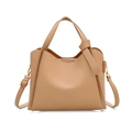 Beige faux leather bucket bag with top handles and adjustable shoulder strap on white base - Khaki