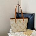 Beige canvas tote bag with brown leather trim and kangaroo logo in variant print - OYE Beige