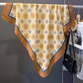Detailed shot of vintage geometric silk scarf with gold and navy blue pattern - 90*90cm / Yellow