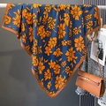 Detail of navy blue floral scarf with orange flower print draped over a metal rod - Dark Blue (HSM-35)