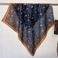 Elegant navy blue silk scarf with gold floral patterns hanging on a metal rack - 68*68cm / Navy Blue Floral Bird Style (FW-66)