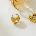 Detailed shot of 18K gold floral ring with white shell petals and mother of pearl accents - US 6 / Flower Shell