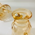 Detailed view of an 18K gold plated ring with a round white pearl on embossed glass - US 6 / Pearl Curved Arc