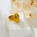 Artistic gold portrait mask ring with blue zircon eyes on a white stone pedestal - US 6 / Mask Blue Zirconia