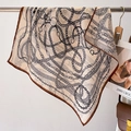 Beige chain print square silk scarf with brown borders shown in aesthetic display - 68*68cm / Caramel Edge