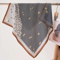 Close-up of geometric letter print silk scarf with brown border detail - 68*68cm / FW-49-Beige Black