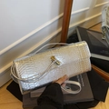 Silver snakeskin clutch with gold twist-lock and metallic textured finish - Silver