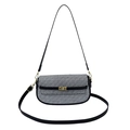 Crossbody bag with black and white geometric pattern and elegant gold twist lock hardware - Black and White