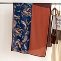 Close-up of dual-sided scarf featuring paisley pattern and orange geometric print - Blue Red (FSM-14)