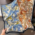 Close-up of tropical leaf print silk scarf with CHANGE lettering on dark blue borders - Black Border (HSM-17) / 90*90cm