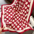 Detail of red and cream camellia flower floral silk scarf with polka dot patterns - Red