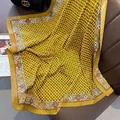 Close-up of vintage yellow silk scarf with chain and floral patterns on leather - 90x90cm / Yellow Edge (HSM-16)