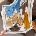 Detail of square scarf with abstract artistic print and rope tassel border on leather sofa - 90*90cm / White (HSM-22)