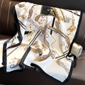 Elegant black and gold paisley silk scarf displayed on a luxury leather sofa - White Gold Baroque (F-327-2) / 90*180cm