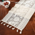 Detailed lace table runner with floral embroidery and tassels on a dark wood table - 30*45cm / Camellia Peacock Feather Beige