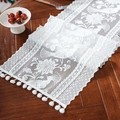 Detailed close-up of white lace table runner with floral patterns and pom-pom fringe - 30*45cm / Camellia Peacock Feather White Pom-pom