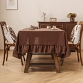 Solid deep brown linen tablecloth featuring elegant ruffled edges for a rustic dining look - 140*100cm / Caramel color
