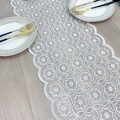 White lace table runner with embroidered floral patterns on a light wooden table - 30*160cm / White