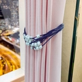 Elegant navy blue braided curtain tieback with light blue pearls on pink curtains - Blue