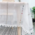 Detail of white candy yarn tablecloth with colorful stripes and pom-pom edge trim - 140*140cm
