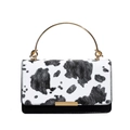 Chic cow print handbag with gold ring handle and metal clasp in a stylish square shape - Black