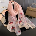 Detail of pink silk blend scarf featuring red tulip embroidery and shimmering gold edges - Pink