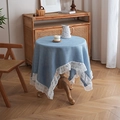 Close-up of blue-grey cotton table cloth with elegant white vintage lace border - 100x100 / Teal