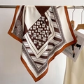 Detailed view of the vintage geometric print and smooth texture on the silk square scarf - 68x68cm / Rust Red (FW-27)