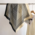 Detail showing the cotton-linen feel fabric and geometric stripes of the square scarf - Beige-Black / 68*68cm