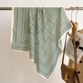 Detail of dark green striped silk scarf hanging with chic fashion accessories - 68*68cm / Beige and Green
