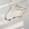 Detail of mixed-metal pig nose anchor chain necklace with subtle light and shadow - Silver Patchwork Style
