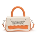 Chic cream and orange contrast leather handbag with wavy flap and silver metal detail - Orange