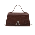 Deep brown crocodile pattern crossbody bag with silver metal buckle on white background - Brown